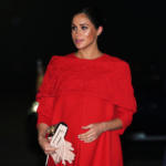 Meghan Markle in Red Valentino Cape Dress for her arrival in Morocco with Prince Harry
